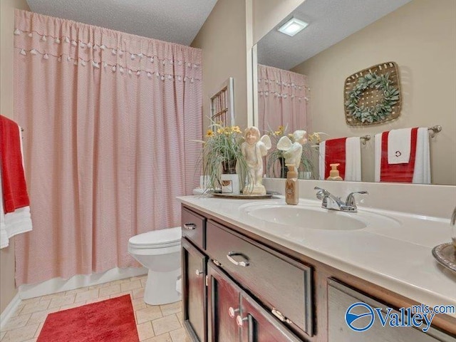 full bathroom with tile patterned floors, toilet, a textured ceiling, vanity, and shower / bath combination with curtain
