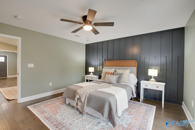 bedroom with hardwood / wood-style flooring and ceiling fan