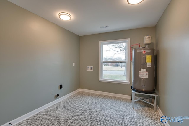 utility room featuring electric water heater