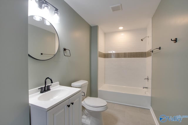 full bathroom with tile patterned flooring, vanity, tub / shower combination, and toilet