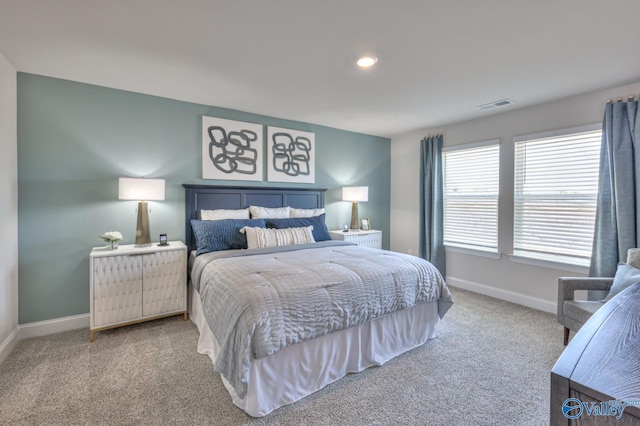 bedroom featuring recessed lighting, carpet, visible vents, and baseboards