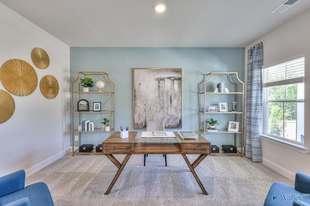 carpeted home office with visible vents and baseboards