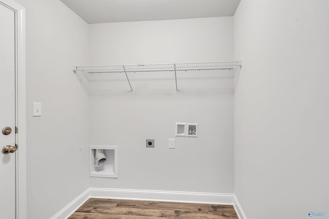 laundry room featuring electric dryer hookup, washer hookup, wood finished floors, baseboards, and laundry area