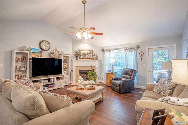 living room featuring vaulted ceiling, ceiling fan, and dark hardwood / wood-style flooring