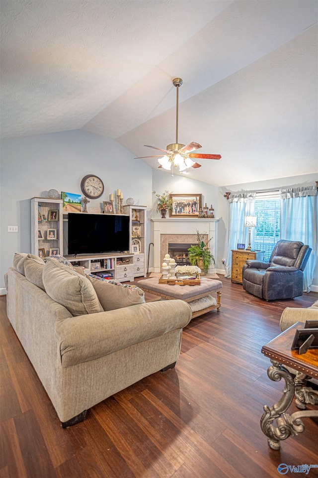 living room featuring lofted ceiling, dark hardwood / wood-style flooring, and ceiling fan