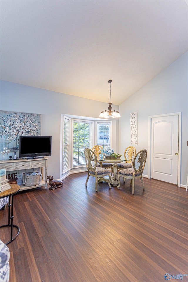 dining room featuring vaulted ceiling, an inviting chandelier, and dark wood-type flooring