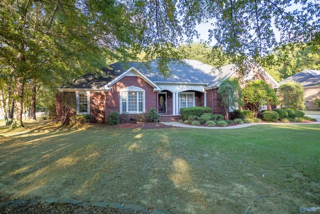 single story home featuring a front lawn