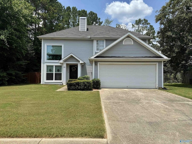 101 Maple Valley Dr, Madison, AL 35758 - traditional home with driveway, a chimney, a front lawn, and an attached garage