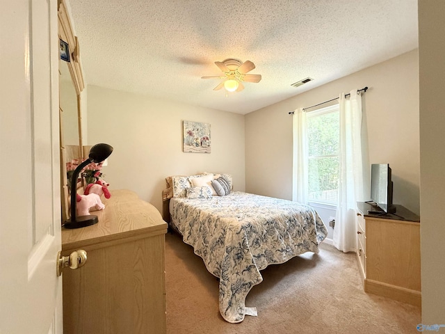 101 Maple Valley Dr, Madison, AL 35758 - carpeted bedroom featuring a textured ceiling and a ceiling fan