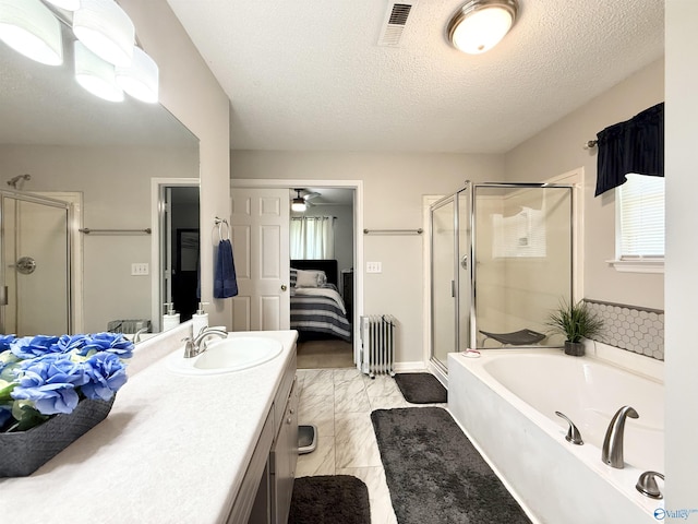 101 Maple Valley Dr, Madison, AL 35758 - bathroom with ensuite bathroom, a shower stall, a bath, vanity, and a textured ceiling