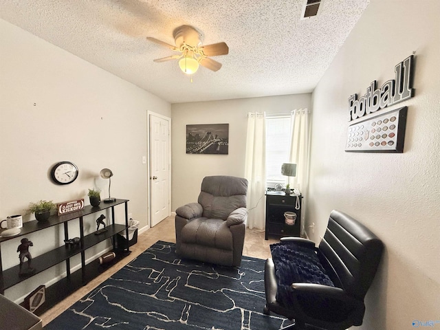 101 Maple Valley Dr, Madison, AL 35758 - sitting room with a ceiling fan, a textured ceiling, light colored carpet, and an office area