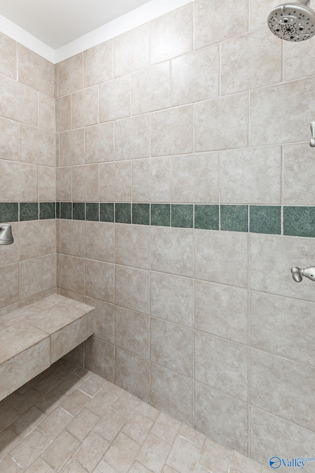 bathroom with tiled shower