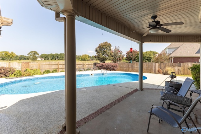 view of pool with a patio and ceiling fan