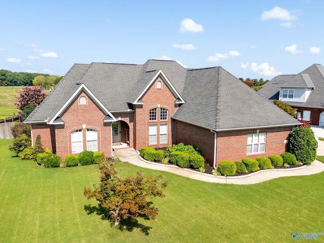 view of front of property with a garage and a front yard