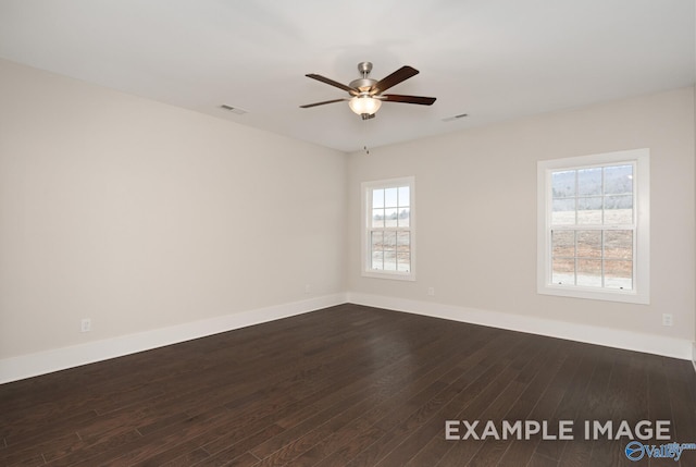 unfurnished room with a ceiling fan, baseboards, visible vents, and dark wood-style flooring