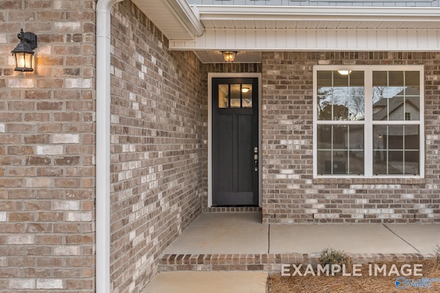 entrance to property with brick siding