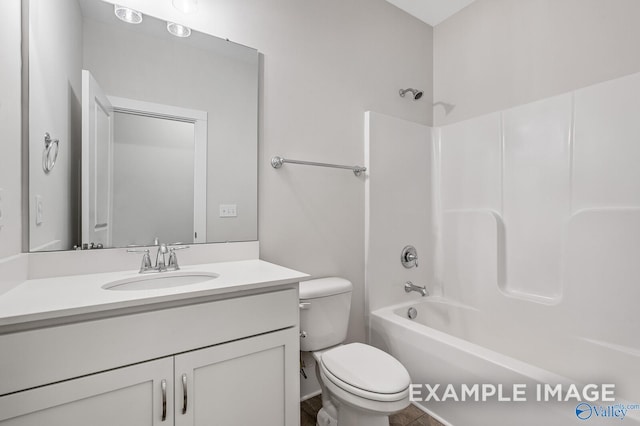 full bathroom featuring shower / tub combination, vanity, and toilet