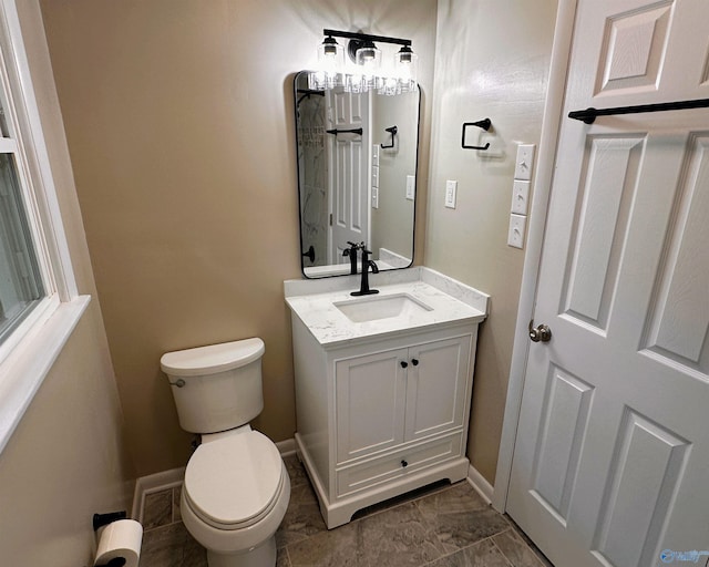 1701 Golf Club Ln NW, Huntsville, AL 35816 - bathroom with toilet, vanity, and baseboards