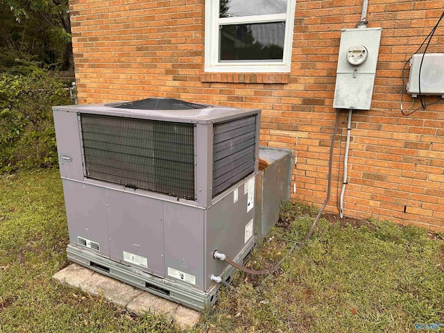 1701 Golf Club Ln NW, Huntsville, AL 35816 - exterior details with cooling unit, electric meter, and brick siding