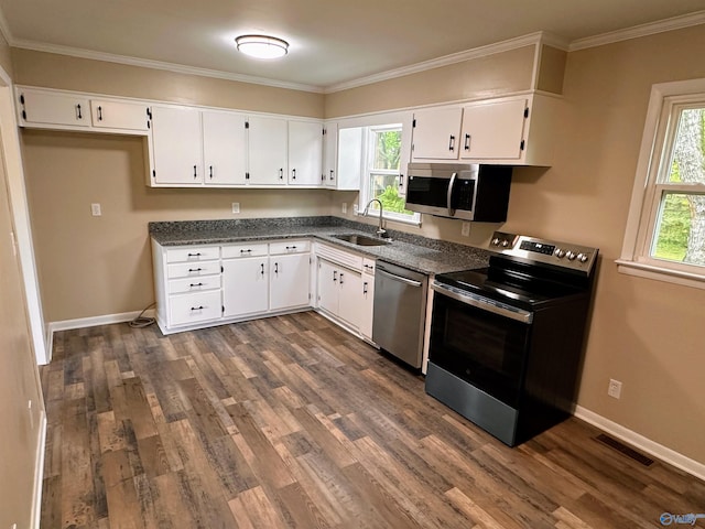 1701 Golf Club Ln NW, Huntsville, AL 35816 - kitchen with a sink, visible vents, white cabinets, appliances with stainless steel finishes, and dark wood finished floors