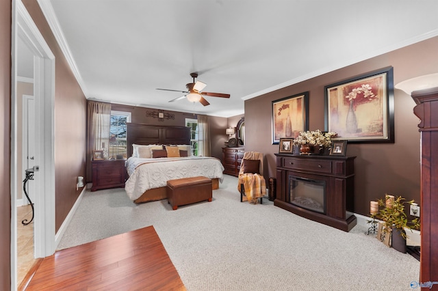 27906 Mooresville Rd, Elkmont, AL 35620 - bedroom with crown molding, baseboards, carpet floors, and ceiling fan