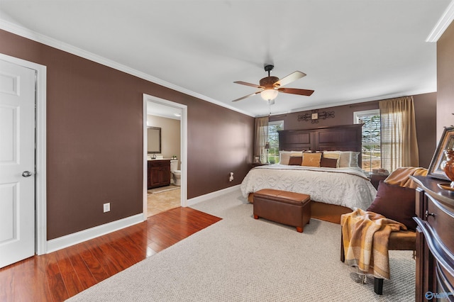 27906 Mooresville Rd, Elkmont, AL 35620 - bedroom featuring wood finished floors, crown molding, baseboards, ensuite bathroom, and a ceiling fan