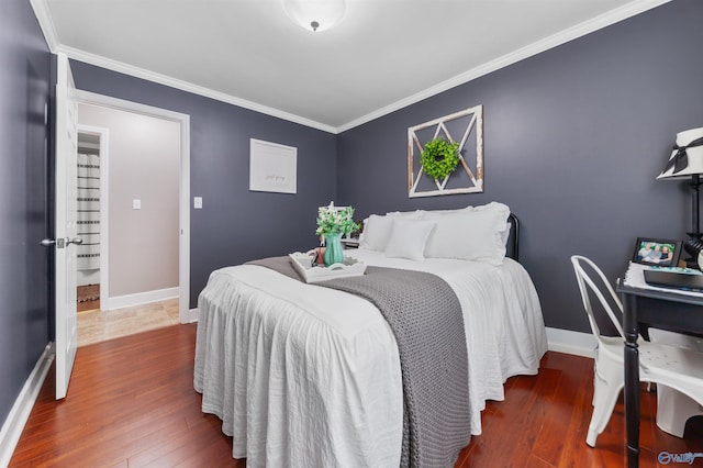 27906 Mooresville Rd, Elkmont, AL 35620 - bedroom with wood finished floors, ornamental molding, and baseboards