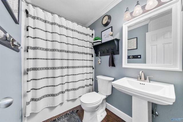 27906 Mooresville Rd, Elkmont, AL 35620 - bathroom with toilet, ornamental molding, wood finished floors, and baseboards