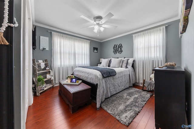 27906 Mooresville Rd, Elkmont, AL 35620 - bedroom featuring multiple windows, hardwood / wood-style floors, ornamental molding, and a ceiling fan