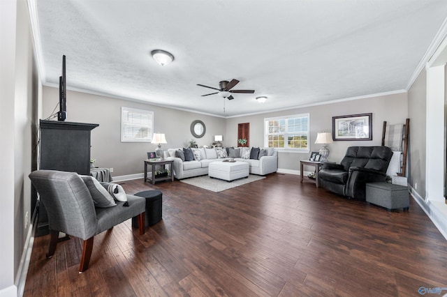27906 Mooresville Rd, Elkmont, AL 35620 - living area featuring a ceiling fan, dark wood-type flooring, baseboards, and crown molding