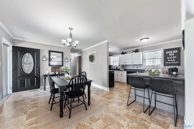 27906 Mooresville Rd, Elkmont, AL 35620 - dining area featuring a chandelier, crown molding, and baseboards