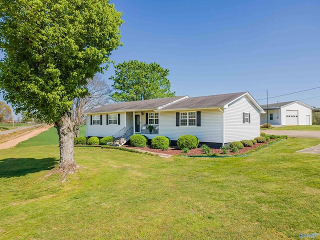 27906 Mooresville Rd, Elkmont, AL 35620 - single story home with a front lawn, a detached garage, and covered porch