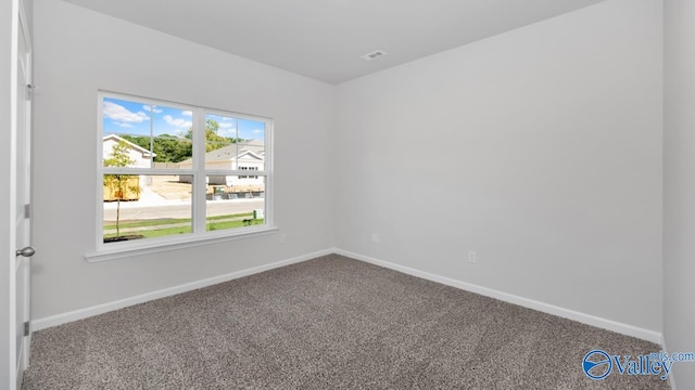 empty room featuring carpet flooring