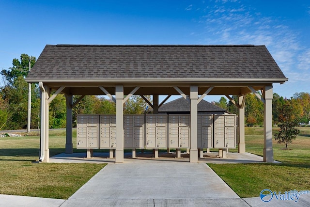 surrounding community featuring a yard and a mail area