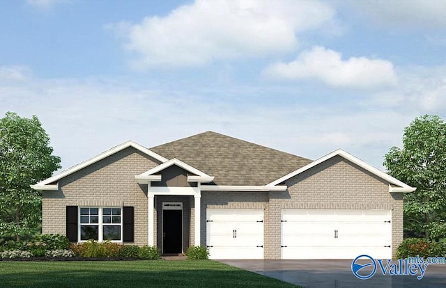 view of front of home with a garage and a front lawn