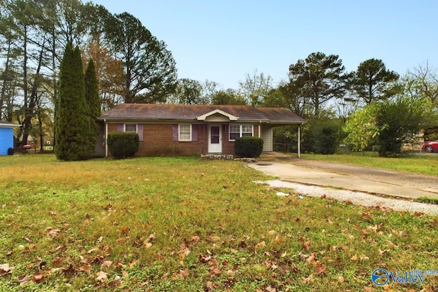 single story home with a front yard and a carport