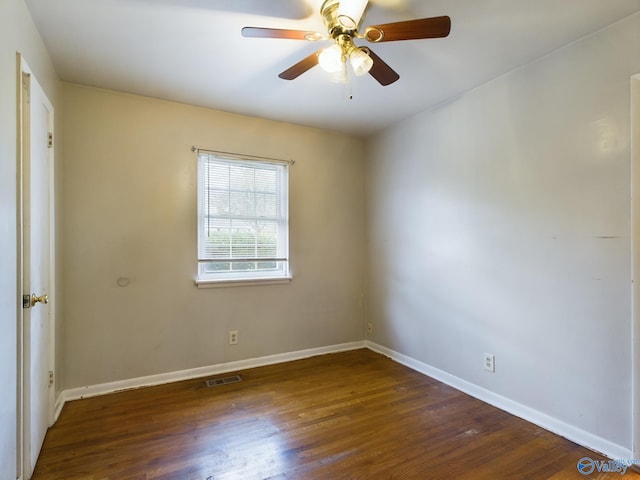 spare room with ceiling fan and dark hardwood / wood-style floors