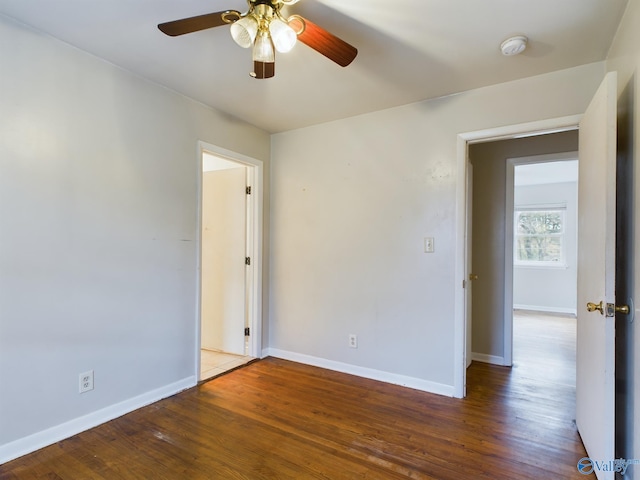 spare room with hardwood / wood-style floors and ceiling fan