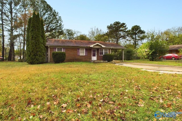 4227 Keith Dr NW, Huntsville, AL 35810 - ranch-style home featuring concrete driveway, a front yard, and brick siding