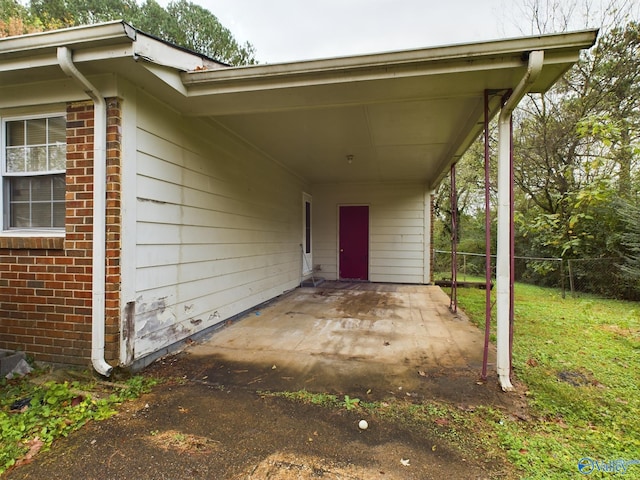 entrance to property featuring a carport