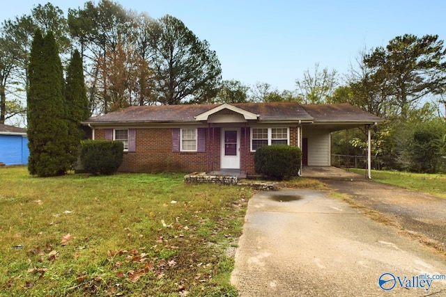 ranch-style house with a front lawn and a carport