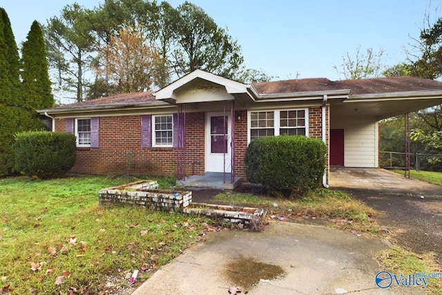 4227 Keith Dr NW, Huntsville, AL 35810 - single story home with brick siding, a carport, and driveway