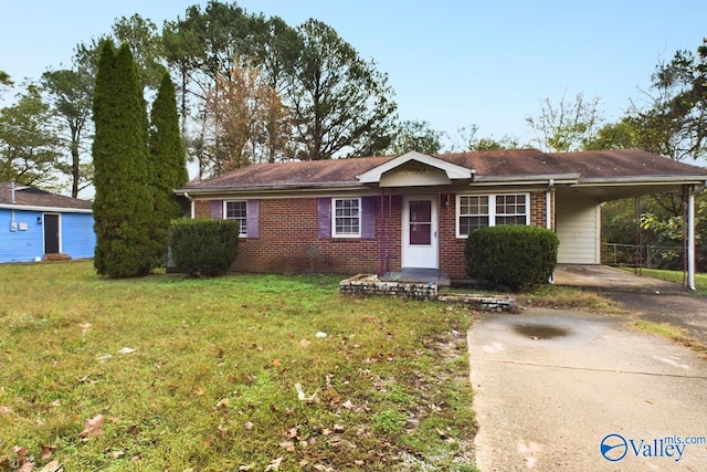 ranch-style home with a front yard and a carport