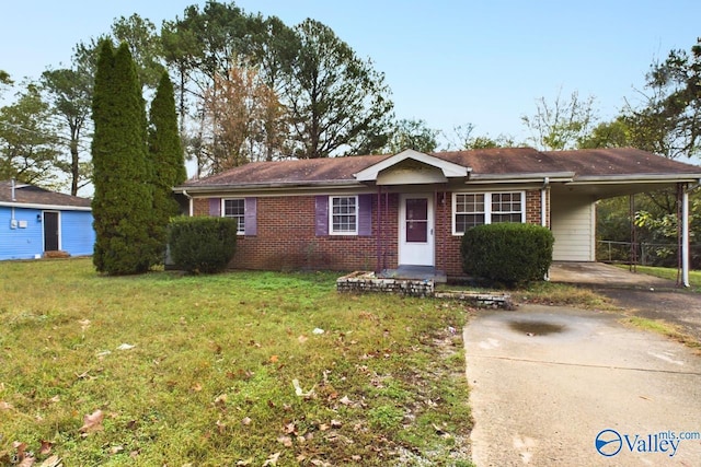 4227 Keith Dr NW, Huntsville, AL 35810 - ranch-style house featuring concrete driveway, a carport, a front lawn, and brick siding