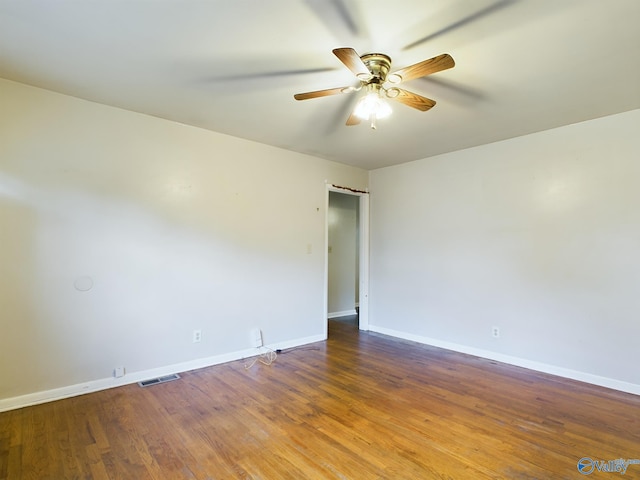 empty room featuring wood-type flooring and ceiling fan