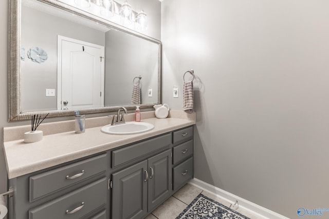 bathroom with tile patterned flooring and vanity