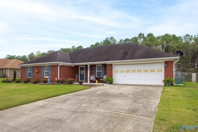 single story home featuring a garage, a front yard, and central AC