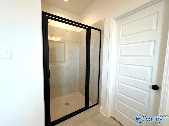 bathroom featuring tile patterned flooring and walk in shower