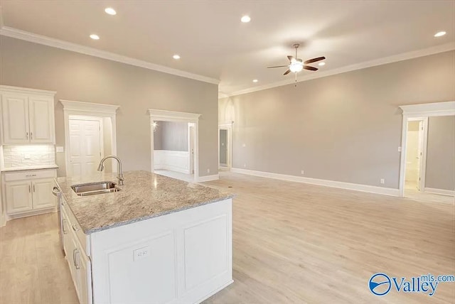 17401 Stonegate Dr, Athens, AL 35613 - kitchen with a sink, ceiling fan, recessed lighting, light wood-style flooring, and crown molding
