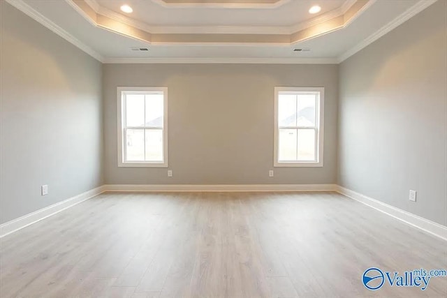 17401 Stonegate Dr, Athens, AL 35613 - empty room featuring a raised ceiling, light wood-style floors, ornamental molding, baseboards, and recessed lighting
